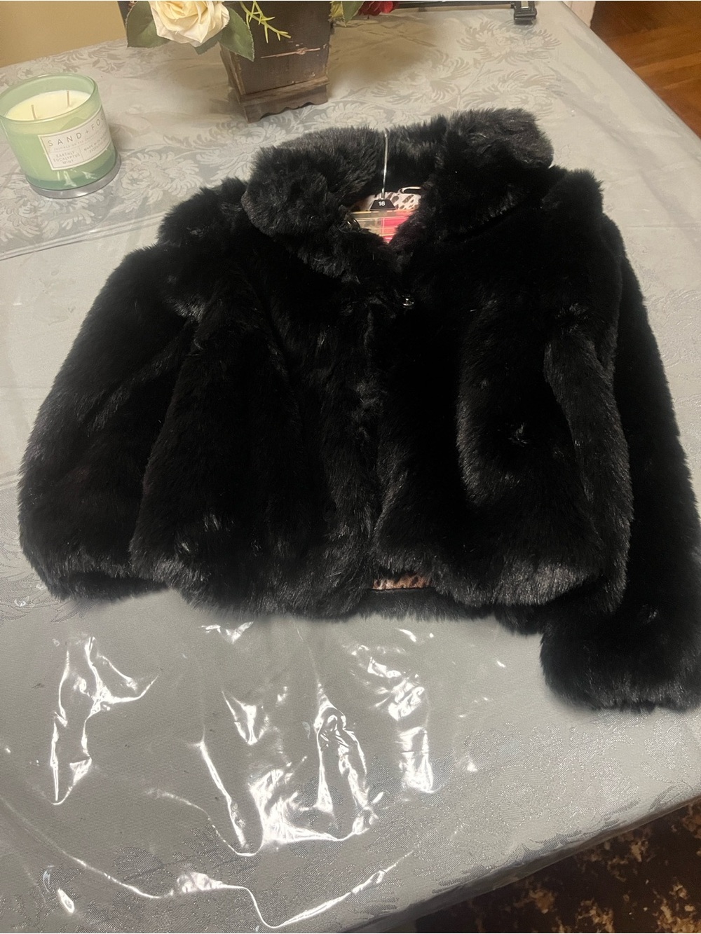 This Black Faux Fur Cropped Jacket is a toddlers size 6